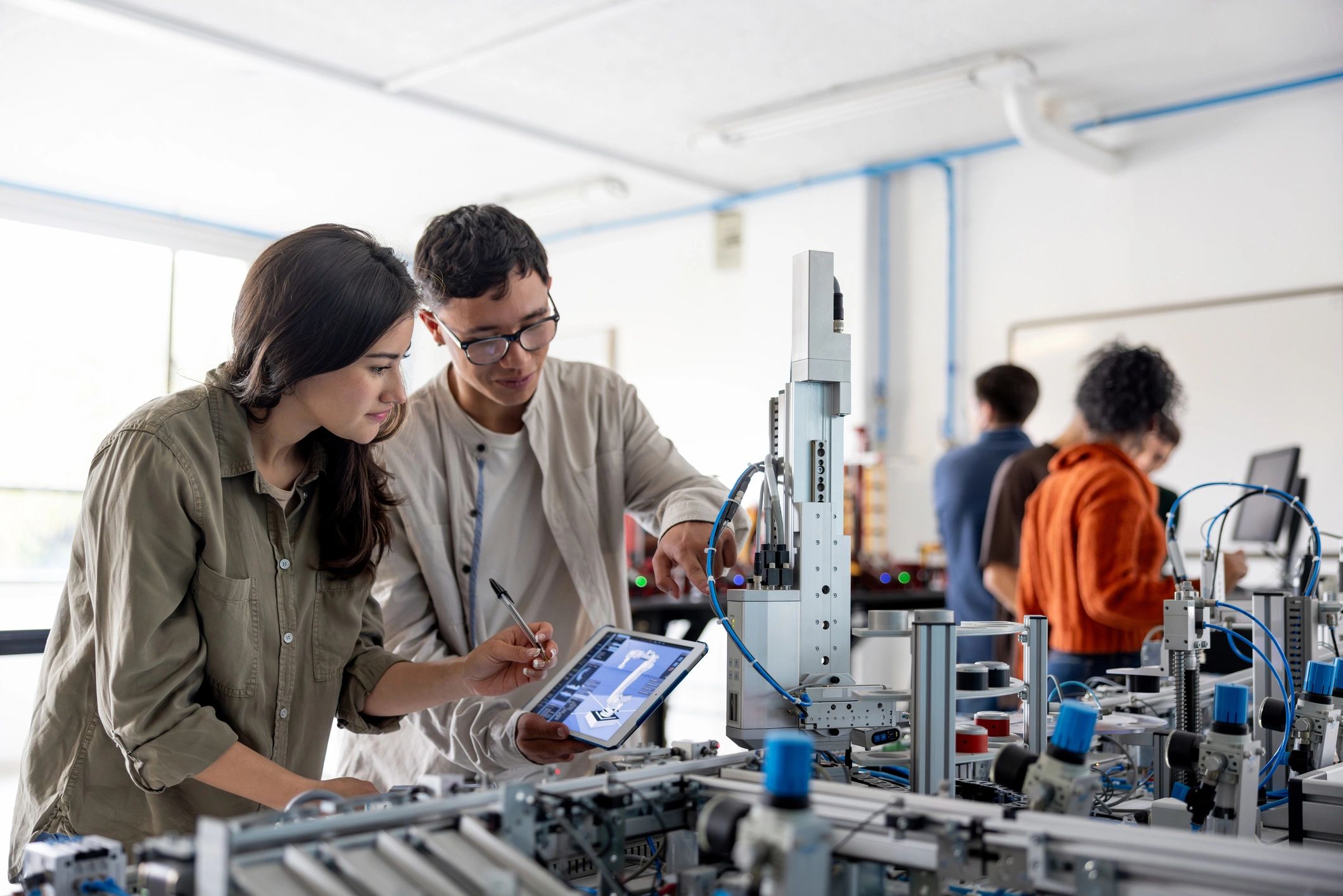 diverse STEM students working together technology